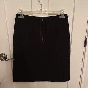 Black size 10 Sandra Angelozzi A-line skirt with exposed back gold zipper